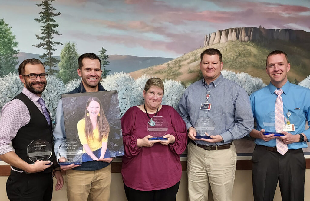 Annual VIA winners, from left, Kelly Williams, Jessica Lindstrom (shown in the photo held by her husband, Dan), Birgit Yorek, Spencer Hill and Josh Ficek.